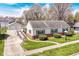 Charming single-story home boasts a well-manicured lawn, brick accents, and a convenient wheelchair ramp at 830 N 16Th St, Elwood, IN 46036