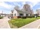 Inviting one-story home featuring a well-kept lawn, brick accents, and an accessible ramp at 830 N 16Th St, Elwood, IN 46036