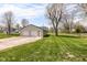 Spacious two-car garage with a large yard, offering ample parking and outdoor space at 830 N 16Th St, Elwood, IN 46036