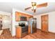 Kitchen with stainless steel appliances, wood cabinets, and wood-look floors at 830 N 16Th St, Elwood, IN 46036