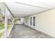 Covered back patio, offering a spacious outdoor area with convenient backyard access at 830 N 16Th St, Elwood, IN 46036