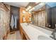 Well-lit bathroom with double sinks, modern fixtures, and ample counter space at 838 Deerfield Rd, Anderson, IN 46012