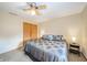 Cozy bedroom with neutral walls, ceiling fan, plush carpet and a double door closet at 838 Deerfield Rd, Anderson, IN 46012