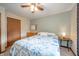 Inviting bedroom with blue and beige color scheme, complete with a ceiling fan and natural light at 838 Deerfield Rd, Anderson, IN 46012