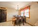Inviting dining room with chandelier, natural light from window, and dark wood table set at 838 Deerfield Rd, Anderson, IN 46012