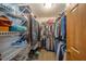 Organized walk-in closet featuring ample shelving, hanging space, and convenient storage solutions at 838 Deerfield Rd, Anderson, IN 46012