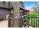 The back deck wraps around a tree and has a whimsical ladder that leads to a second-story elevated deck at 889 Cedar Wood Pl, Carmel, IN 46032