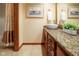 Bathroom featuring granite countertop vanity and framed mirror at 889 Cedar Wood Pl, Carmel, IN 46032