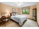 Cozy bedroom offering a tranquil retreat with a view of nature and a comfortable sleeping space at 889 Cedar Wood Pl, Carmel, IN 46032