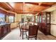 Formal dining room featuring a wood coffered ceiling, chandelier, and built-in china cabinet at 889 Cedar Wood Pl, Carmel, IN 46032
