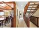 Inviting hallway featuring staircase with wooden railings and sightlines into the dining room at 889 Cedar Wood Pl, Carmel, IN 46032