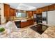 Beautiful kitchen featuring granite countertops, stainless appliances, and an open layout at 889 Cedar Wood Pl, Carmel, IN 46032