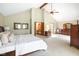 Spacious main bedroom with vaulted ceiling, ceiling fan, ensuite bathroom, and walk-in closet at 889 Cedar Wood Pl, Carmel, IN 46032