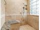 Tiled shower with built-in bench and glass block window at 889 Cedar Wood Pl, Carmel, IN 46032