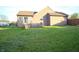 Backyard with house, lawn and wooden fence at 8911 Country Walk Ct, Indianapolis, IN 46227
