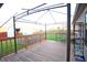 A wooden backyard deck with metal pergola and railing at 8911 Country Walk Ct, Indianapolis, IN 46227