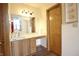 Bathroom vanity with marble countertop, drawers, and door at 8911 Country Walk Ct, Indianapolis, IN 46227