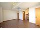 Bedroom featuring hardwood floors, built-in shelves, and an adjoining bathroom at 8911 Country Walk Ct, Indianapolis, IN 46227