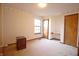 Bedroom with wall-to-wall carpeting, window, and desk at 8911 Country Walk Ct, Indianapolis, IN 46227