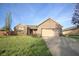 Beautiful one-story home with a two-car garage and well-manicured front yard at 8911 Country Walk Ct, Indianapolis, IN 46227
