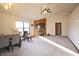 Cozy living room with vaulted ceilings, a brick fireplace, neutral carpet and large window at 8911 Country Walk Ct, Indianapolis, IN 46227