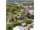 Aerial view highlighting the property's boundaries and location within a green, tree-filled neighborhood at 911 W Washington Ave, Shelbyville, IN 46176