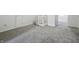 Finished attic space with neutral carpeting and white walls that could be used for storage at 911 W Washington Ave, Shelbyville, IN 46176