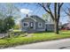 Charming home with a gray exterior, a well-manicured lawn, and an inviting front entrance at 911 W Washington Ave, Shelbyville, IN 46176