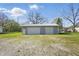 Two car detached garage with gravel driveway, perfect for additional storage and parking at 911 W Washington Ave, Shelbyville, IN 46176
