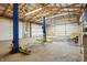 Spacious garage interior with lift, ramp, and abundant lighting provides a great workspace at 911 W Washington Ave, Shelbyville, IN 46176