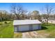 Two car detached garage featuring a silver roof and ample space on a well maintained lot at 911 W Washington Ave, Shelbyville, IN 46176