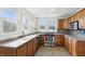 Bright kitchen with stainless steel appliances, granite counters and tile backsplash at 911 W Washington Ave, Shelbyville, IN 46176