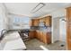 Kitchen with stainless steel appliances, sleek granite countertops and light oak cabinets at 911 W Washington Ave, Shelbyville, IN 46176