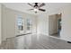Living room with french doors leading to the outside and wood-style laminate flooring at 911 W Washington Ave, Shelbyville, IN 46176