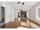 Bright living room featuring hardwood floors, white walls, and a modern fireplace at 911 W Washington Ave, Shelbyville, IN 46176