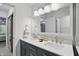 Bathroom with double sink vanity and views of the bedroom and closet at 9309 Golden Woods Dr, Indianapolis, IN 46268