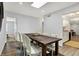 Dining room featuring rustic table and chairs, adjacent to updated kitchen at 9309 Golden Woods Dr, Indianapolis, IN 46268