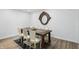 Elegant dining room features a wooden table, stylish chairs, and a decorative mirror at 9309 Golden Woods Dr, Indianapolis, IN 46268