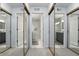 Hallway view of mirrored closet doors leading to a bathroom with a shower at 9309 Golden Woods Dr, Indianapolis, IN 46268