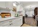 Beautiful kitchen with white cabinets, stainless steel appliances, and hardwood floors at 9309 Golden Woods Dr, Indianapolis, IN 46268