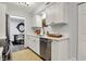 Bright kitchen featuring white cabinets, stainless steel appliances, and modern fixtures at 9309 Golden Woods Dr, Indianapolis, IN 46268
