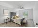 Comfortable main bedroom with a ceiling fan, natural light, and neutral decor at 9309 Golden Woods Dr, Indianapolis, IN 46268