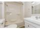 Bathroom featuring a shower and tub combo, white vanity and modern fixtures at 9535 E Michigan St, Indianapolis, IN 46229