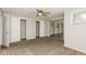 Bedroom featuring ceiling fan, two closets, and sliding glass doors at 9535 E Michigan St, Indianapolis, IN 46229