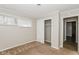 Cozy bedroom with a window, carpeted floor, and closet at 9535 E Michigan St, Indianapolis, IN 46229