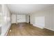 Spacious living room featuring laminate flooring, a decorative fireplace and ample natural light at 9535 E Michigan St, Indianapolis, IN 46229