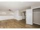 Living room boasts hardwood floors, built-in cabinets, and a closet for storage at 9535 E Michigan St, Indianapolis, IN 46229