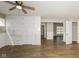 Spacious living room featuring hardwood floors and built-in shelving, offering ample storage space at 9535 E Michigan St, Indianapolis, IN 46229