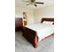 Bedroom featuring carpeted floors and a view into the bathroom; dark wooden furniture at 9671 Trail Dr, Avon, IN 46123