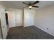 This bedroom features neutral walls, plush carpet, and a closet for storage at 9671 Trail Dr, Avon, IN 46123